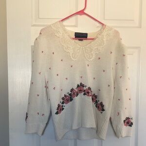 Elegant Cream Sweater with Pink Floral Pattern